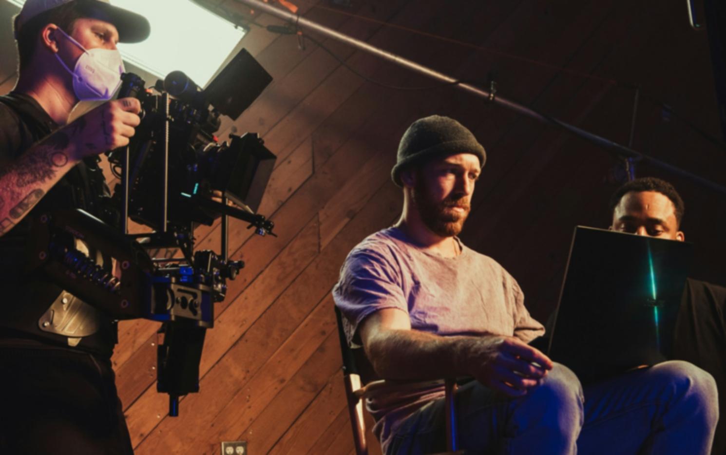 Video production workspace showing camera and editing setup